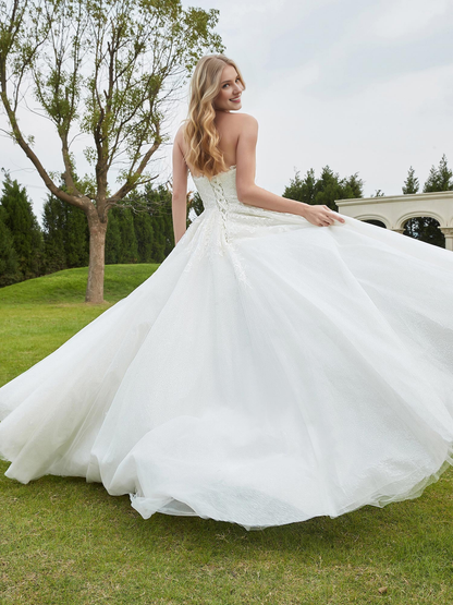 Sweetheart lace pleats sweep across trailing wedding dress