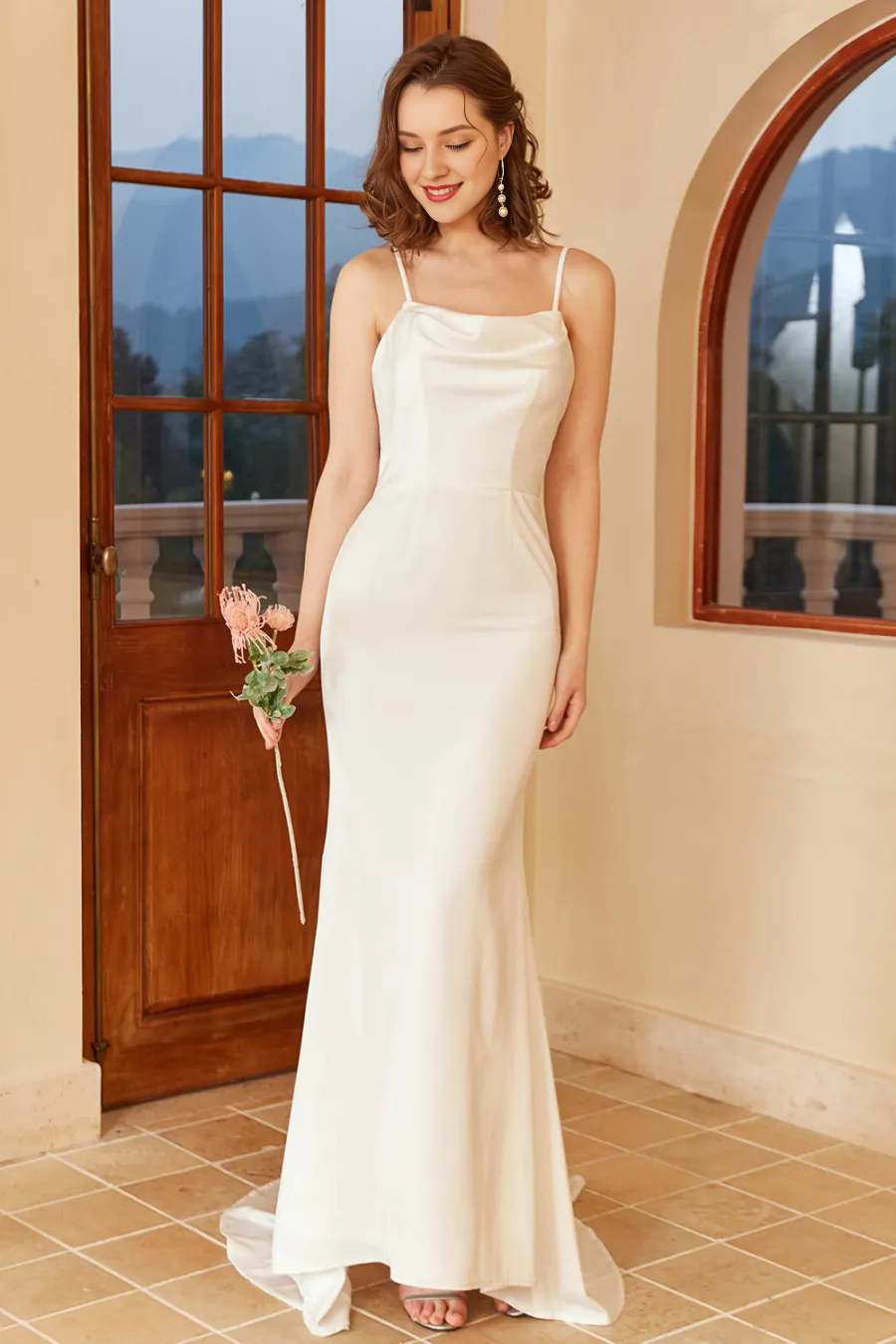 White thin shoulder strap with exposed back and floor minimalist wedding dress