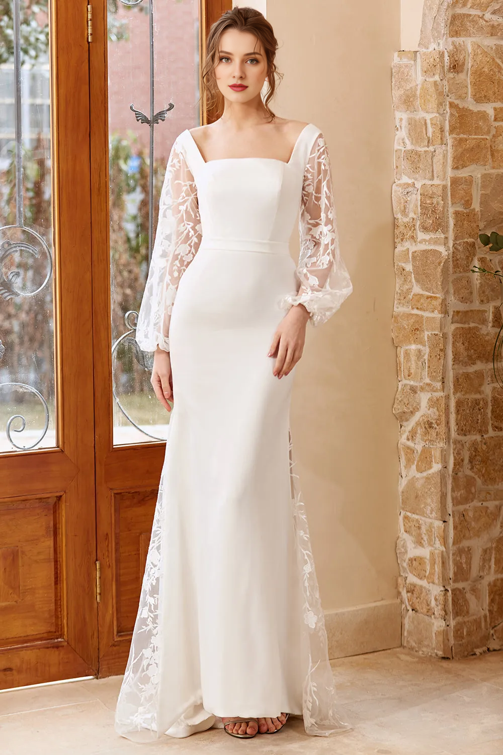 White fishtail long sleeved and floor length wedding dress