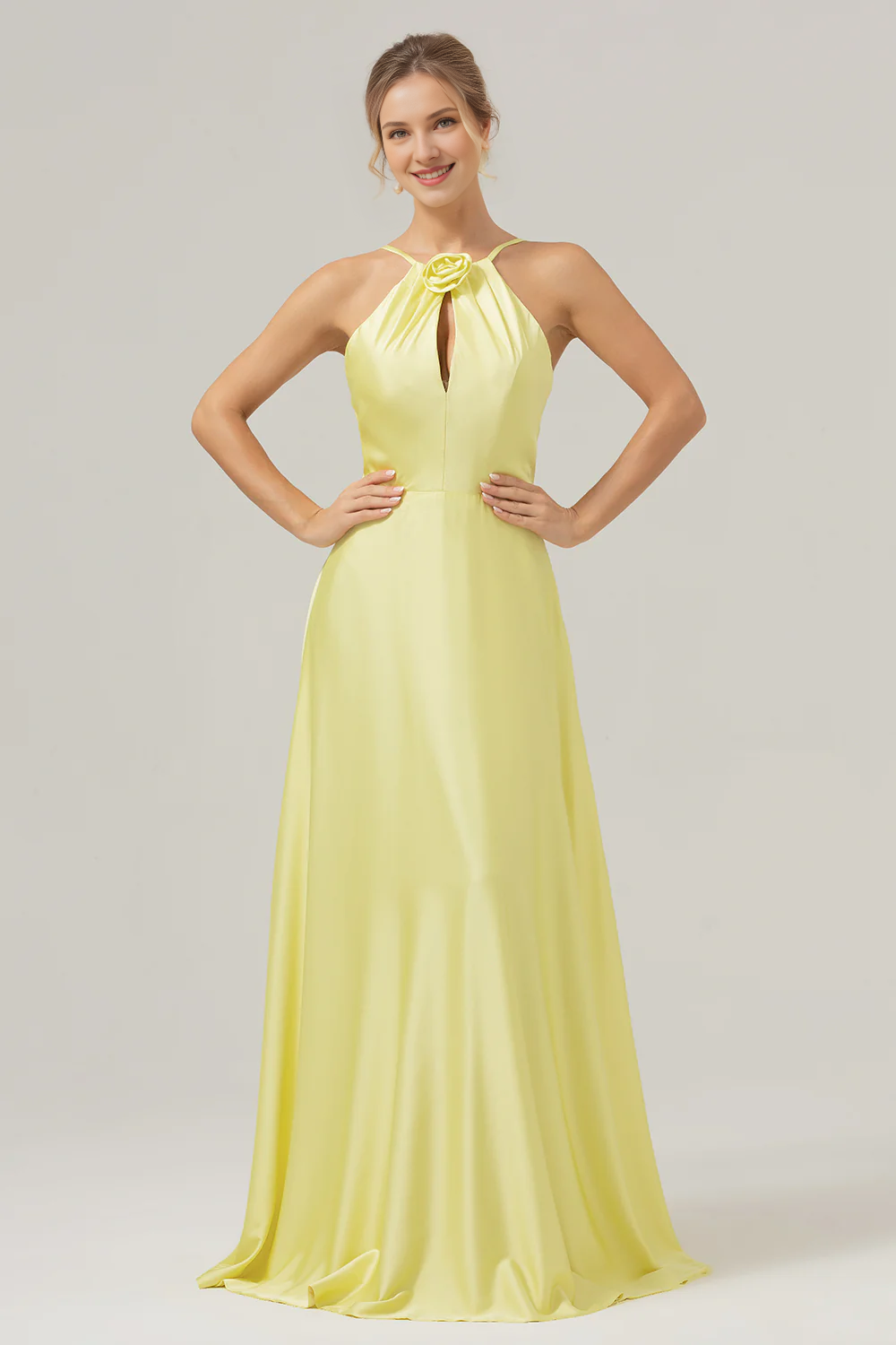 Yellow A-line hanging neck, exposed back, and floor length bridesmaid dress with flowers