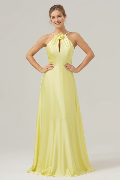 Yellow A-line hanging neck, exposed back, and floor length bridesmaid dress with flowers