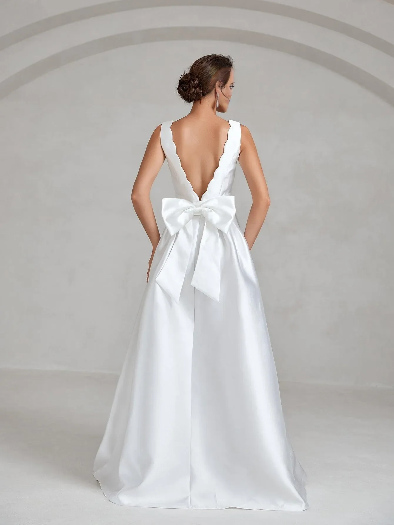 Elegant and minimalist backless satin and floor length wedding dress