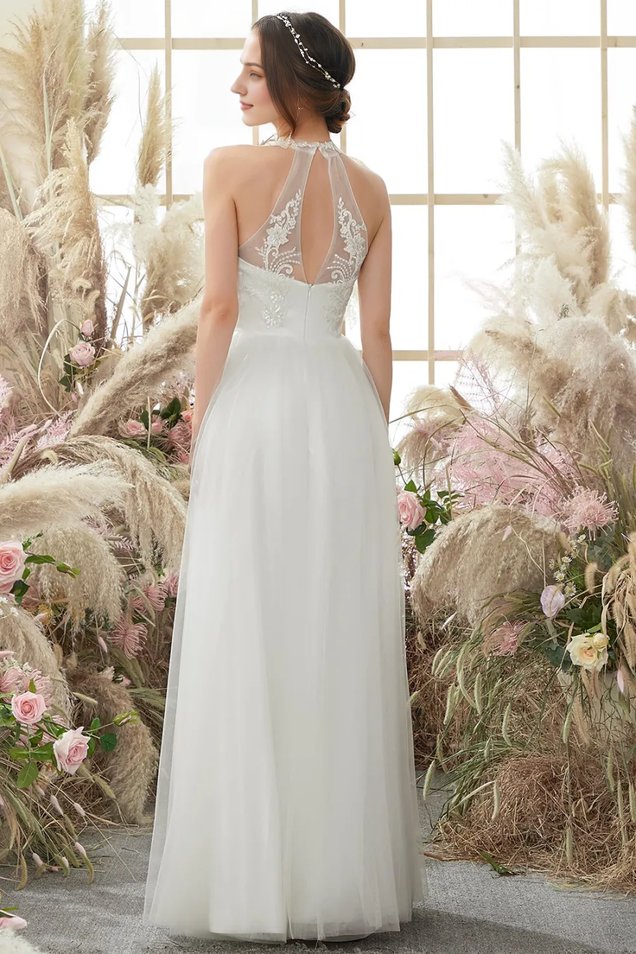 White neck hanging, backless and floor length wedding dress