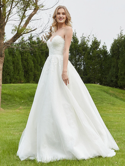 Sweetheart lace pleats sweep across trailing wedding dress