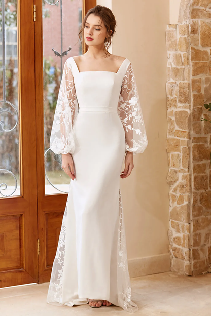 White fishtail long sleeved and floor length wedding dress