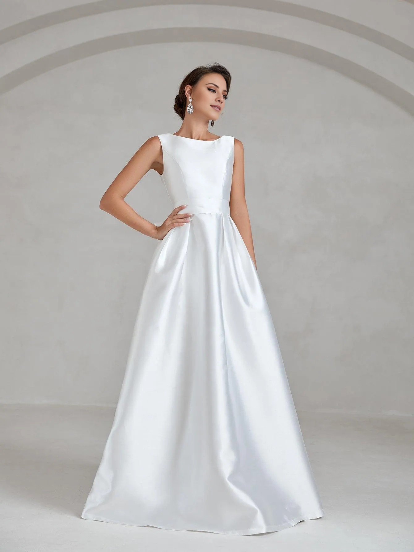 Elegant and minimalist backless satin and floor length wedding dress