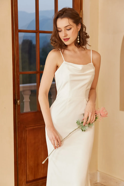 White thin shoulder strap with exposed back and floor minimalist wedding dress