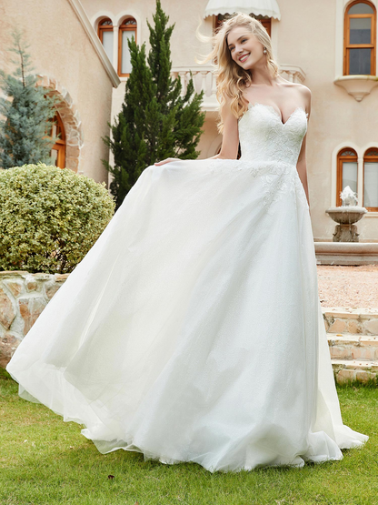 Sweetheart lace pleats sweep across trailing wedding dress