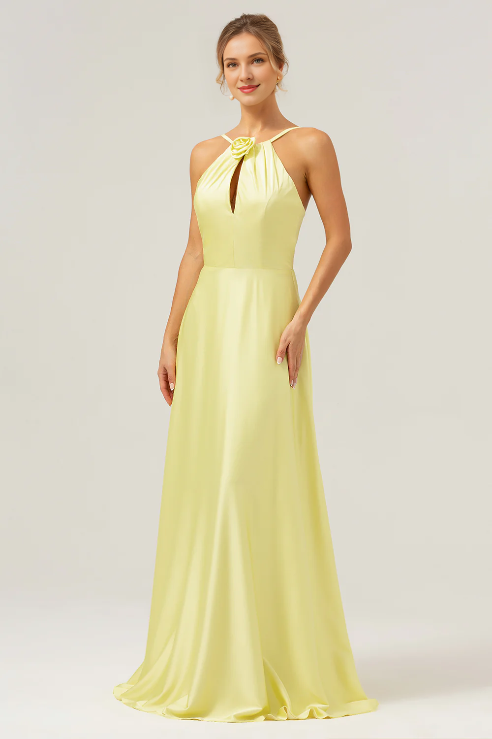 Yellow A-line hanging neck, exposed back, and floor length bridesmaid dress with flowers