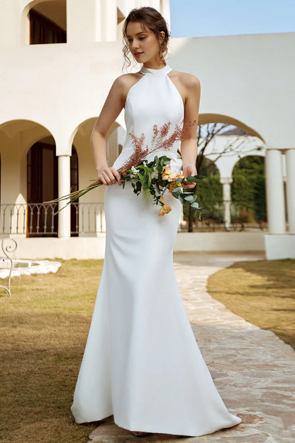 White fishtail backless and floor length wedding dress