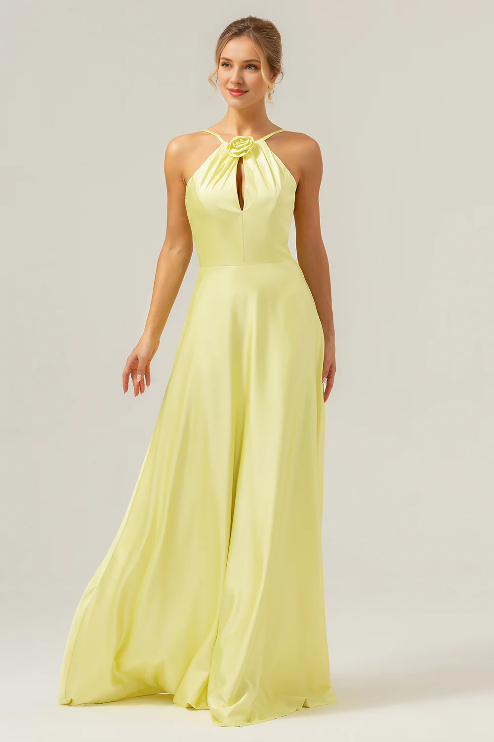 Yellow A-line hanging neck, exposed back, and floor length bridesmaid dress with flowers