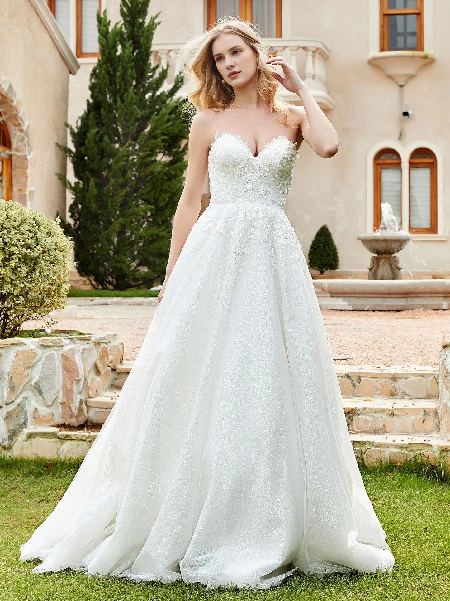 Sweetheart lace pleats sweep across trailing wedding dress