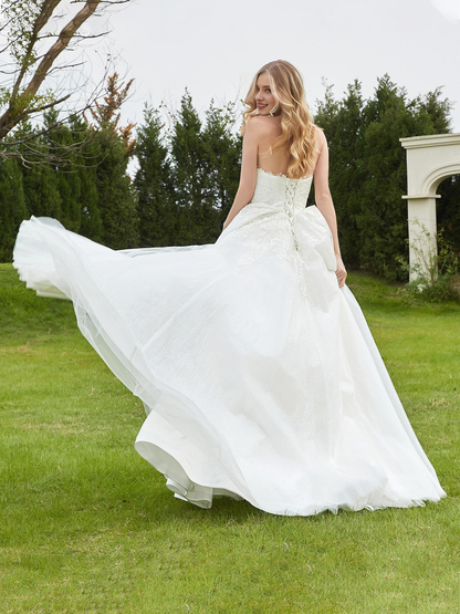 Sweetheart lace pleats sweep across trailing wedding dress