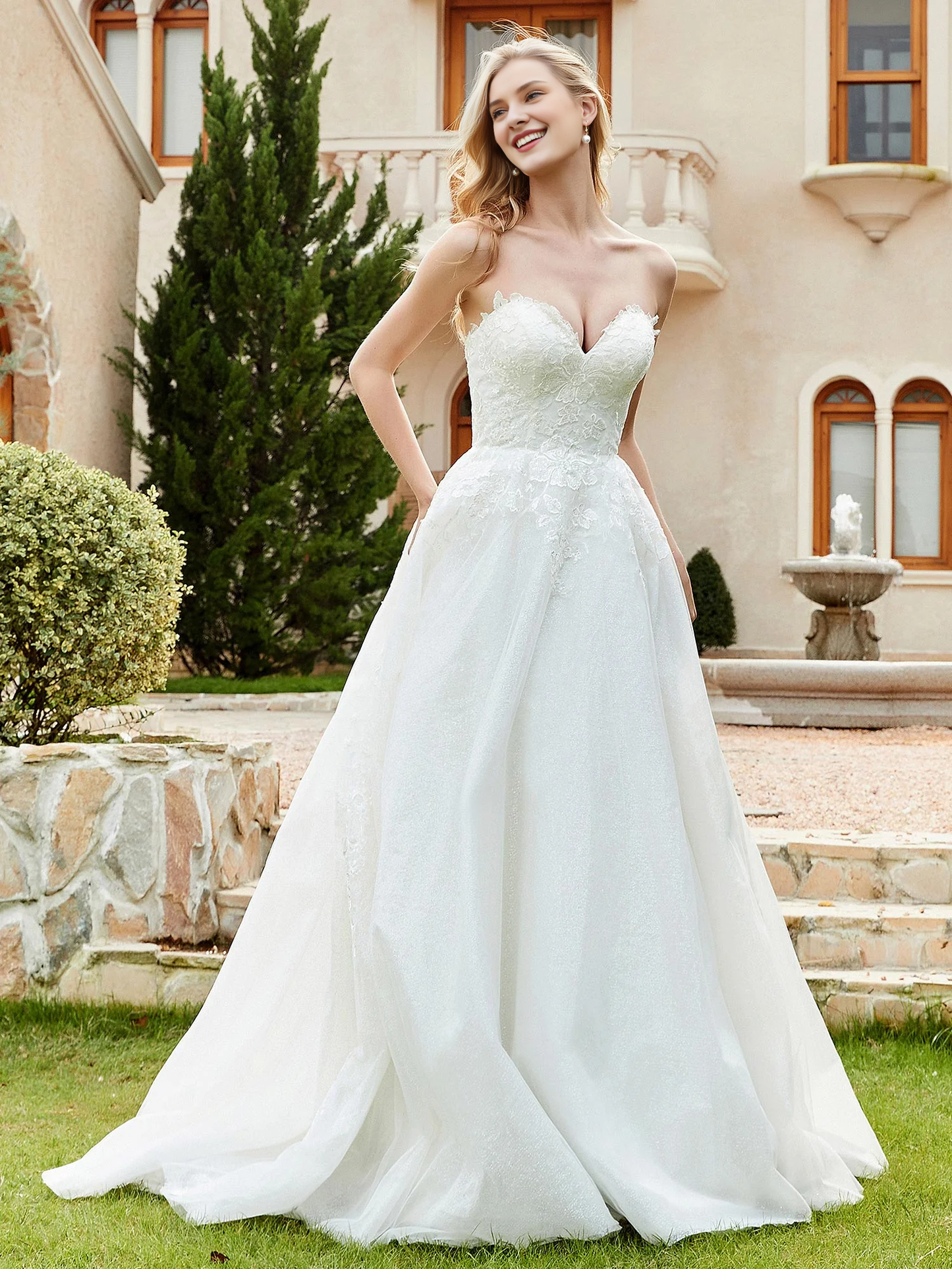 Sweetheart lace pleats sweep across trailing wedding dress